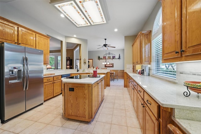 kitchen with light tile patterned floors, stainless steel fridge with ice dispenser, decorative backsplash, and recessed lighting