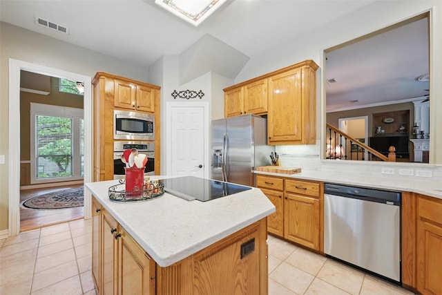 kitchen with visible vents, appliances with stainless steel finishes, light tile patterned floors, and tasteful backsplash