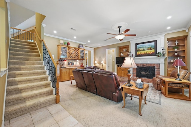 living area featuring crown molding, visible vents, stairs, ceiling fan, and recessed lighting
