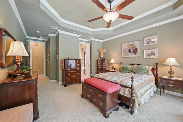 bedroom featuring visible vents, carpet, ornamental molding, and a raised ceiling