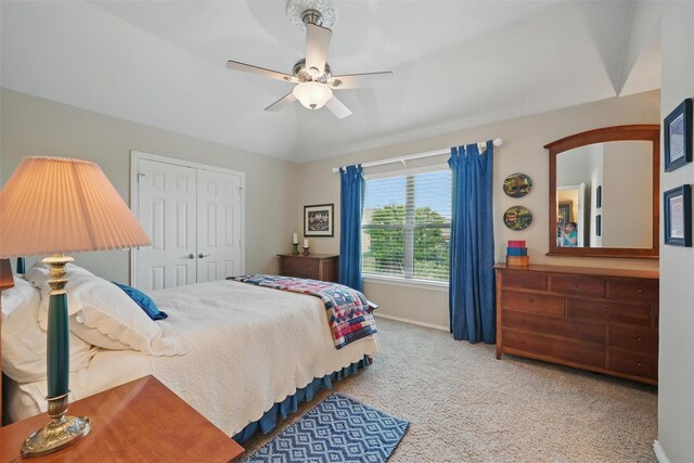 carpeted bedroom with baseboards, ceiling fan, and a closet