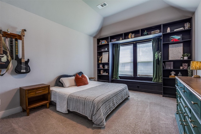 bedroom with light colored carpet, baseboards, visible vents, and lofted ceiling