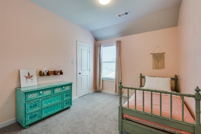 bedroom with baseboards, lofted ceiling, visible vents, and light carpet