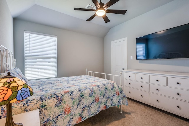 bedroom featuring visible vents, carpet flooring, ceiling fan, and lofted ceiling