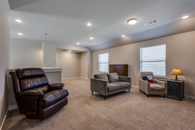 carpeted living room with visible vents, recessed lighting, and baseboards