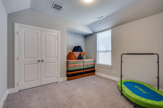 rec room featuring baseboards, vaulted ceiling, carpet, and visible vents