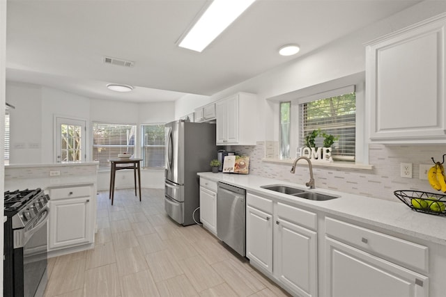 2624 Misty Glen Dr, Flower Mound, TX 75028 - kitchen featuring appliances with stainless steel finishes, a sink, and tasteful backsplash