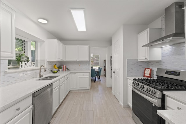 2624 Misty Glen Dr, Flower Mound, TX 75028 - kitchen with stainless steel appliances, wall chimney exhaust hood, a sink, and healthy amount of natural light
