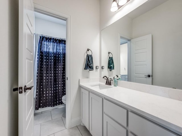 full bathroom featuring toilet, curtained shower, tile patterned flooring, and vanity