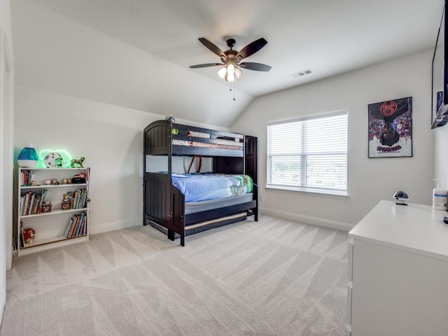 carpeted bedroom with baseboards, ceiling fan, lofted ceiling, and visible vents