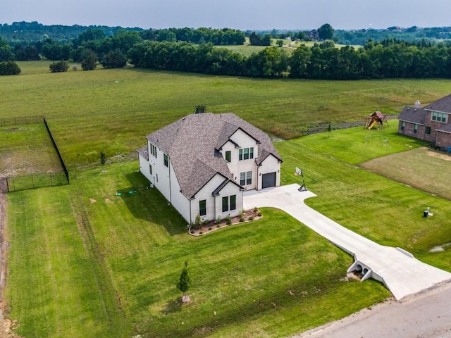 birds eye view of property with a rural view