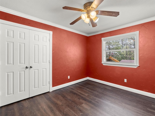 unfurnished bedroom with baseboards, ornamental molding, ceiling fan, and wood finished floors