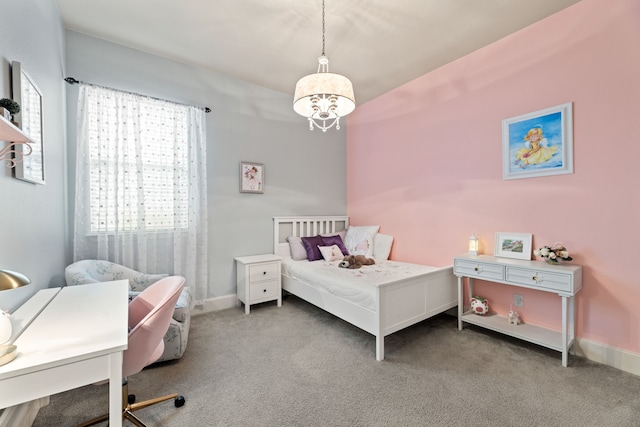 bedroom featuring an inviting chandelier, carpet floors, and baseboards