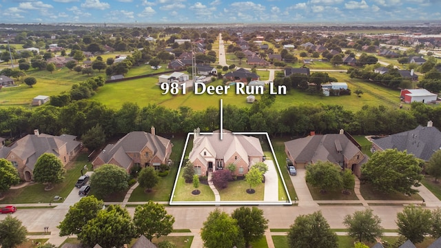 981 Deer Run Ln, Prosper, TX 75078 - view of front of home with a front lawn and brick siding
