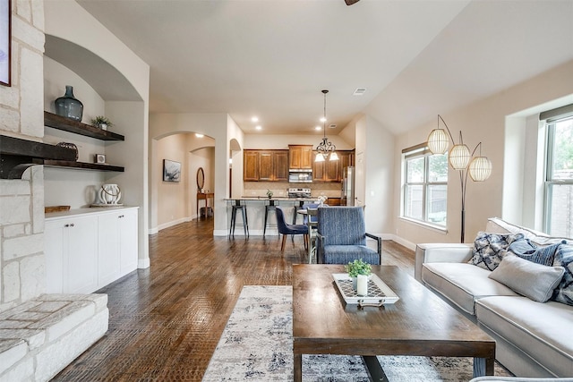 11948 Carlin Dr, Fort Worth, TX 76108 - living area with dark wood-style flooring, arched walkways, and baseboards