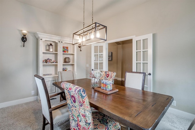 11948 Carlin Dr, Fort Worth, TX 76108 - dining space featuring baseboards, carpet floors, and a chandelier