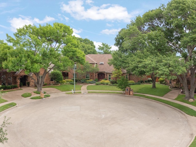 6916 April Way Cir, Plano, TX 75023 - view of front of home featuring a front yard and brick siding