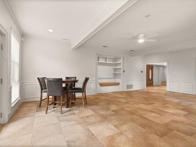 6916 April Way Cir, Plano, TX 75023 - dining area with crown molding, visible vents, a decorative wall, and a ceiling fan