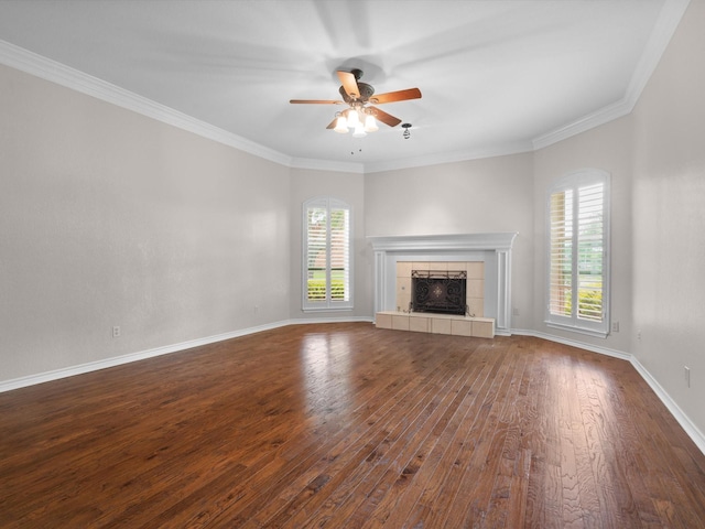 6916 April Way Cir, Plano, TX 75023 - unfurnished living room featuring a wealth of natural light, dark wood-style flooring, a ceiling fan, and a fireplace