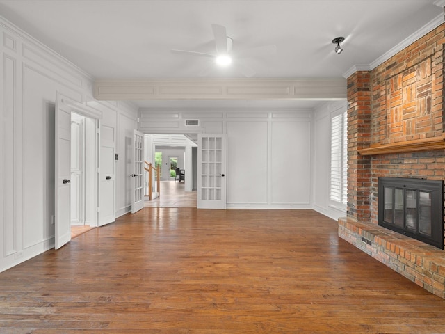 6916 April Way Cir, Plano, TX 75023 - unfurnished living room featuring a decorative wall, a ceiling fan, french doors, and wood finished floors
