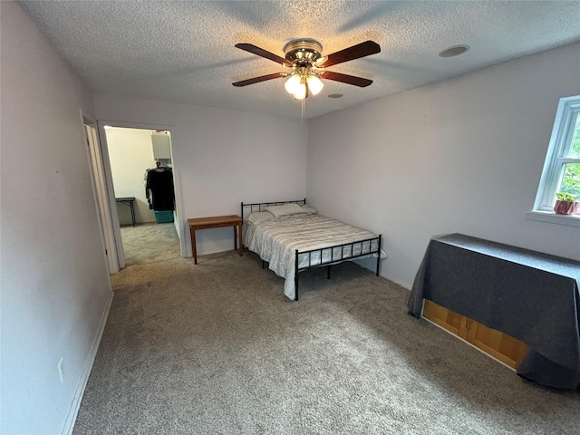 1207 W Cage St, Stephenville, TX 76401 - carpeted bedroom featuring a ceiling fan and a textured ceiling