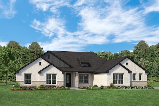 modern farmhouse featuring roof with shingles, board and batten siding, a front lawn, and brick siding