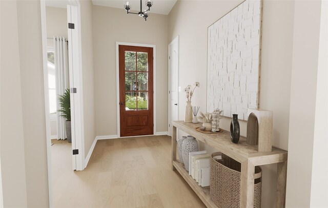 doorway featuring baseboards and light wood-type flooring