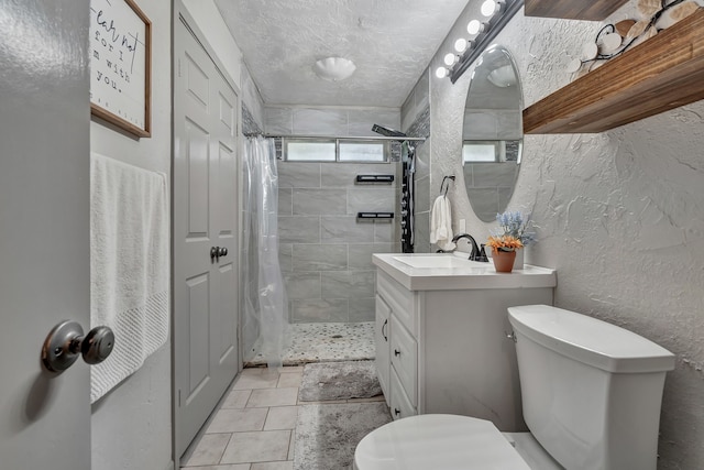 full bathroom with a textured wall, toilet, and tiled shower