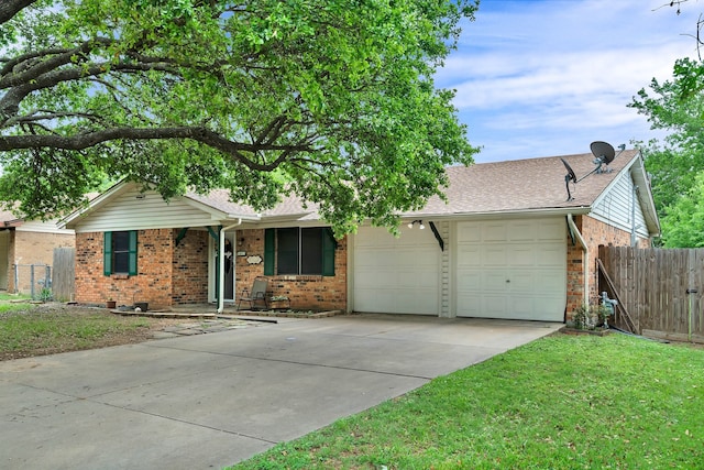 ranch-style house featuring brick siding, a garage, fence, and driveway