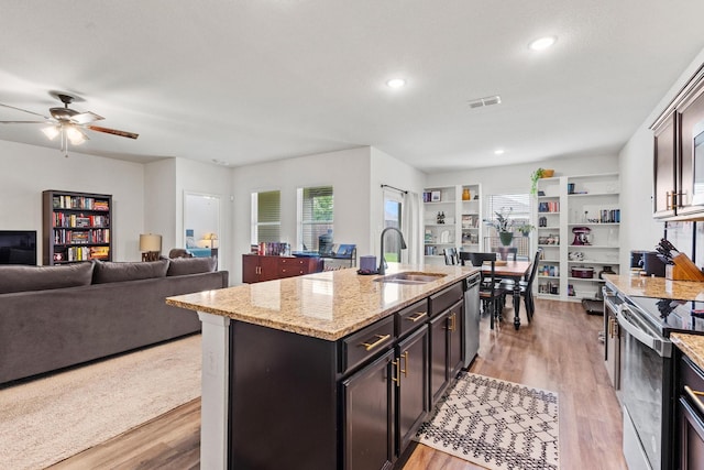 1823 Wolf Run, Anna, TX 75409 - kitchen featuring visible vents, electric range oven, dishwasher, a sink, and light wood-style flooring