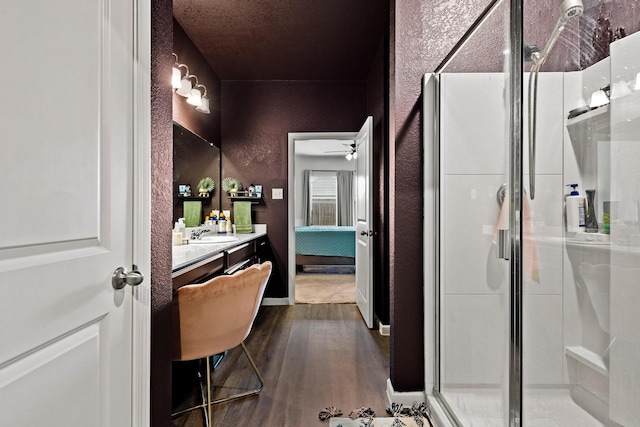 1823 Wolf Run, Anna, TX 75409 - bathroom featuring ceiling fan, a shower stall, wood finished floors, vanity, and a textured wall