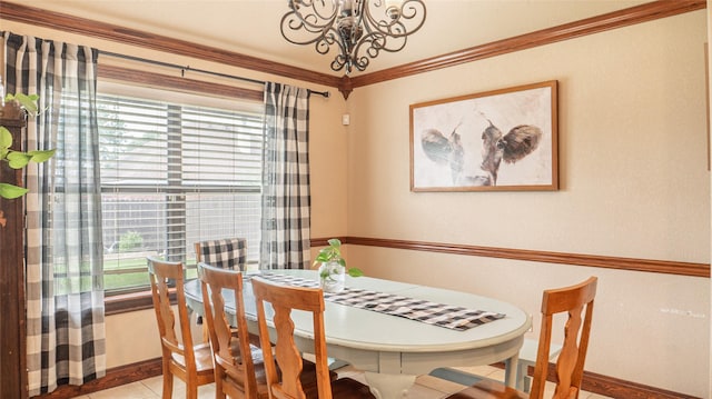 dining area featuring baseboards, a notable chandelier, tile patterned flooring, and a healthy amount of sunlight