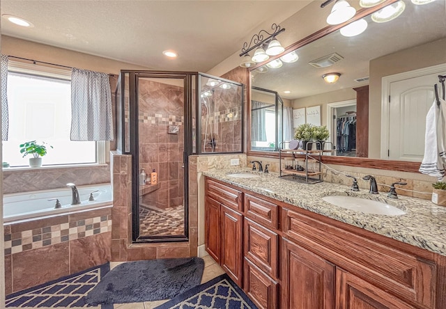full bath featuring visible vents, a shower stall, and a sink