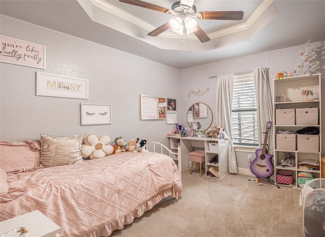 bedroom featuring carpet flooring, a ceiling fan, crown molding, and a raised ceiling