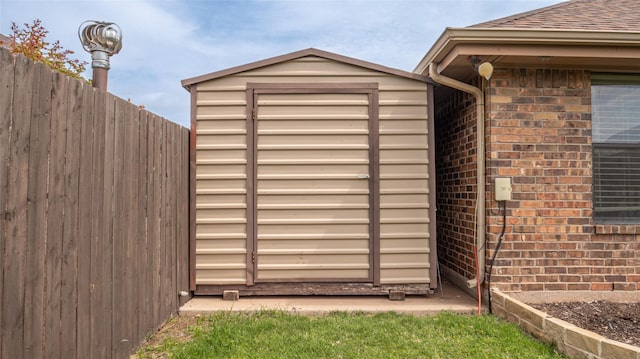 view of shed with fence