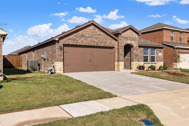 3033 Zinnia St, Royse City, TX 75189 - view of front of property with brick siding, an attached garage, concrete driveway, central AC, and stone siding