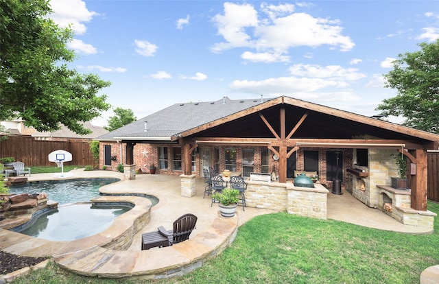 rear view of house featuring fence, outdoor dry bar, a shingled roof, brick siding, and a patio