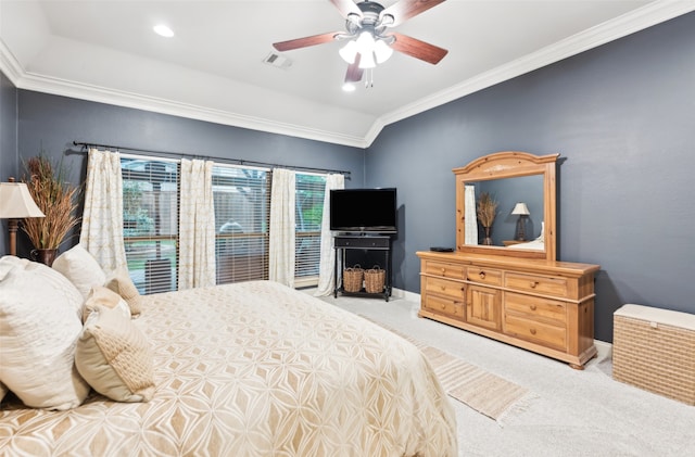 carpeted bedroom with baseboards, ornamental molding, a ceiling fan, and visible vents