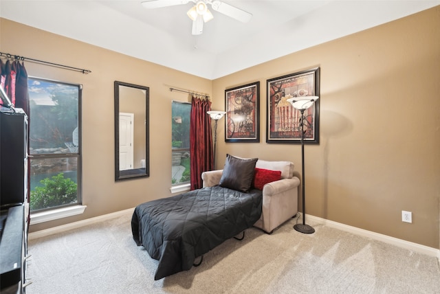 carpeted bedroom featuring a ceiling fan and baseboards