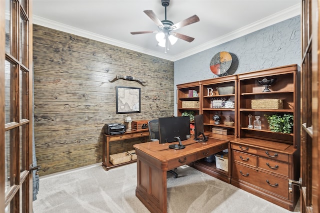 office area with crown molding, a ceiling fan, and light colored carpet