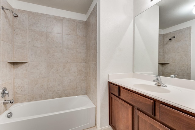 bathroom with shower / bathtub combination and vanity