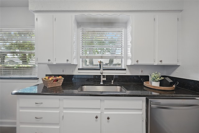 528 Chambers St, Denton, TX 76205 - kitchen with stainless steel dishwasher, a sink, white cabinetry, and dark stone counters