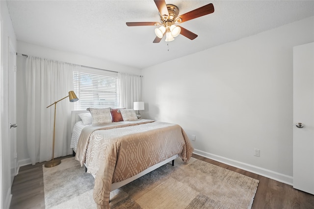 528 Chambers St, Denton, TX 76205 - bedroom featuring baseboards, ceiling fan, and wood finished floors