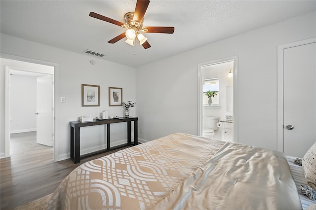 528 Chambers St, Denton, TX 76205 - bedroom with ceiling fan, dark wood finished floors, baseboards, ensuite bathroom, and visible vents
