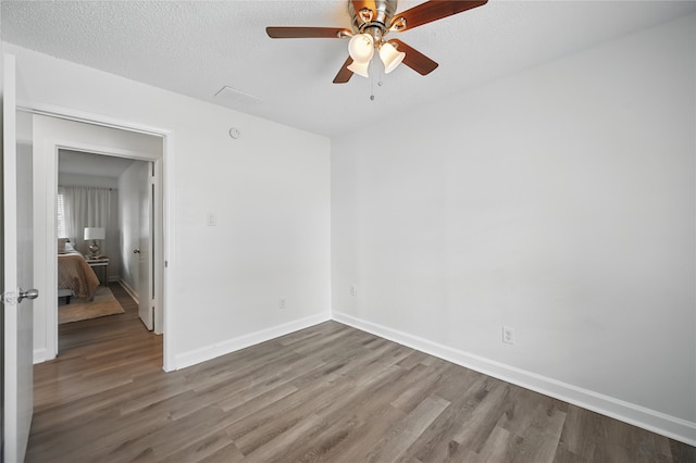 528 Chambers St, Denton, TX 76205 - interior space featuring baseboards, a textured ceiling, and wood finished floors