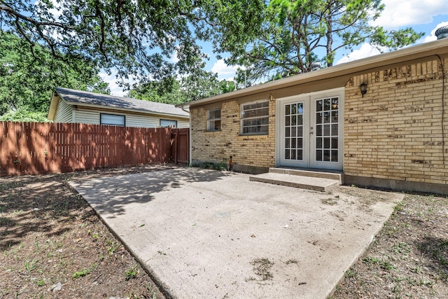 528 Chambers St, Denton, TX 76205 - view of patio / terrace featuring fence and french doors