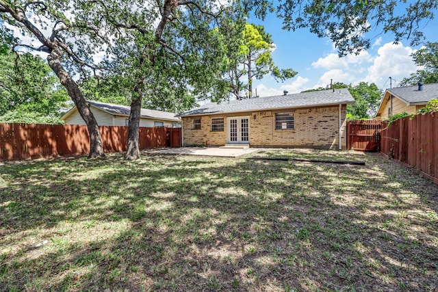 528 Chambers St, Denton, TX 76205 - back of house with a yard, french doors, and a fenced backyard