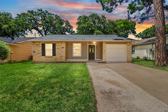 528 Chambers St, Denton, TX 76205 - single story home featuring brick siding, a garage, a front yard, and concrete driveway