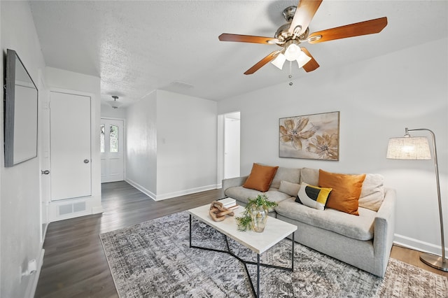 528 Chambers St, Denton, TX 76205 - living room with a textured ceiling, a ceiling fan, baseboards, wood finished floors, and visible vents
