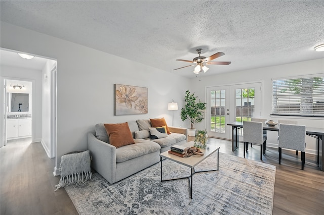 528 Chambers St, Denton, TX 76205 - living area with french doors, a textured ceiling, ceiling fan, and wood finished floors
